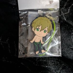 Anime Character Keychain with Green and Black Design